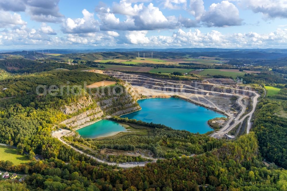 Aerial photograph Balve - Site and tailings area of the gravel mining ond flooded gravel pit in Balve in the state North Rhine-Westphalia, Germany