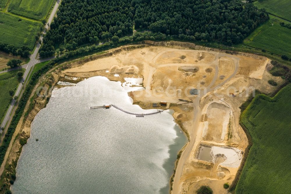 Fredenbeck from the bird's eye view: Site and tailings area of the gravel mining in Fredenbeck in the state Lower Saxony, Germany