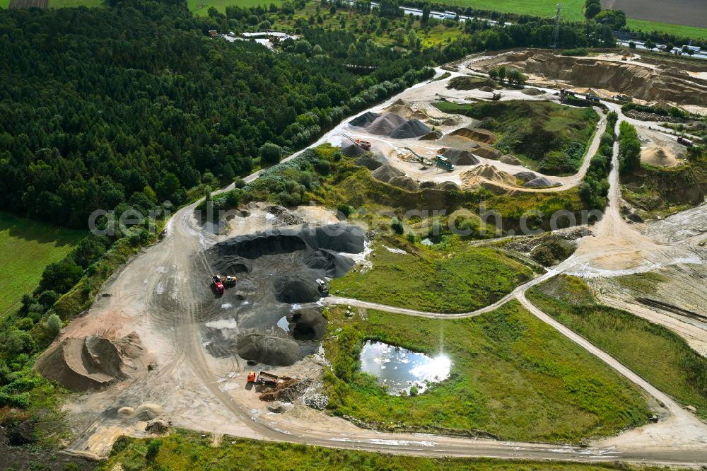 Dibbersen from above - Site and tailings area of the gravel mining on motorway BAB A1 in Dibbersen in the state Lower Saxony, Germany