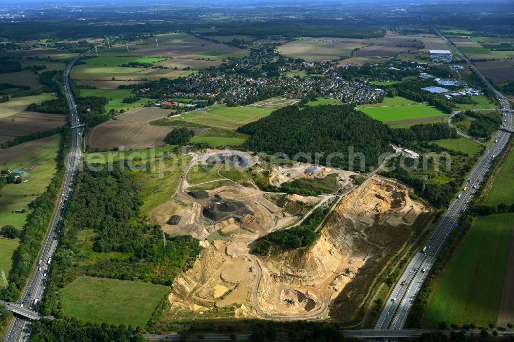 Aerial image Dibbersen - Site and tailings area of the gravel mining on motorway BAB A1 in Dibbersen in the state Lower Saxony, Germany