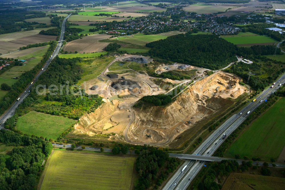 Aerial image Dibbersen - Site and tailings area of the gravel mining on motorway BAB A1 in Dibbersen in the state Lower Saxony, Germany