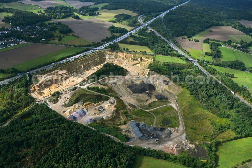 Aerial image Dibbersen - Site and tailings area of the gravel mining on motorway BAB A1 in Dibbersen in the state Lower Saxony, Germany