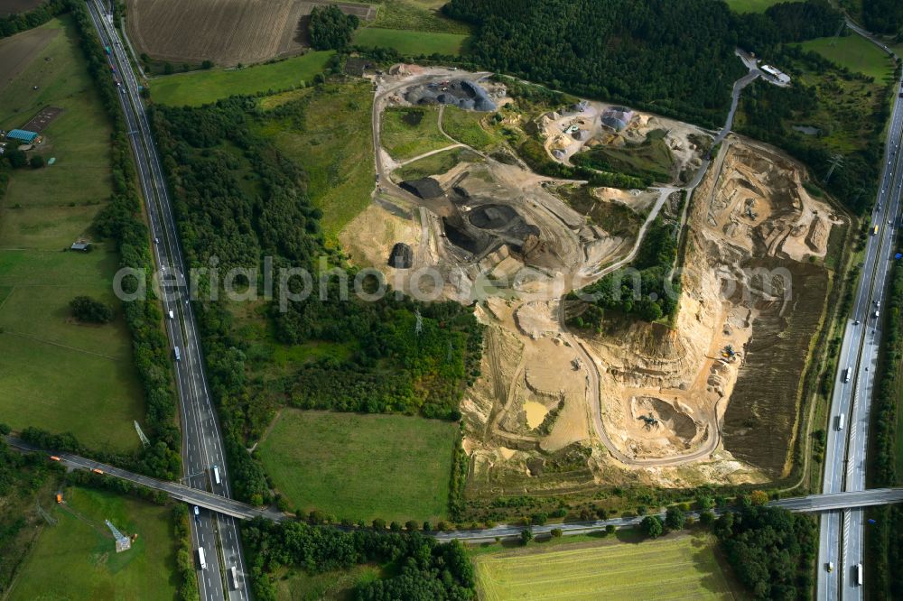 Aerial image Dibbersen - Site and tailings area of the gravel mining on motorway BAB A1 in Dibbersen in the state Lower Saxony, Germany