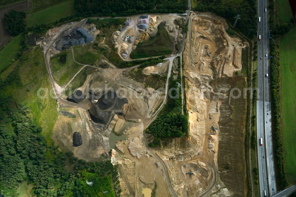 Aerial image Dibbersen - Site and tailings area of the gravel mining on motorway BAB A1 in Dibbersen in the state Lower Saxony, Germany