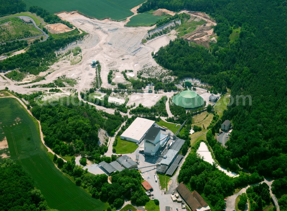 Eisenberg (Pfalz) from the bird's eye view: Site and tailings area of the gravel mining in Eisenberg (Pfalz) in the state Rhineland-Palatinate, Germany