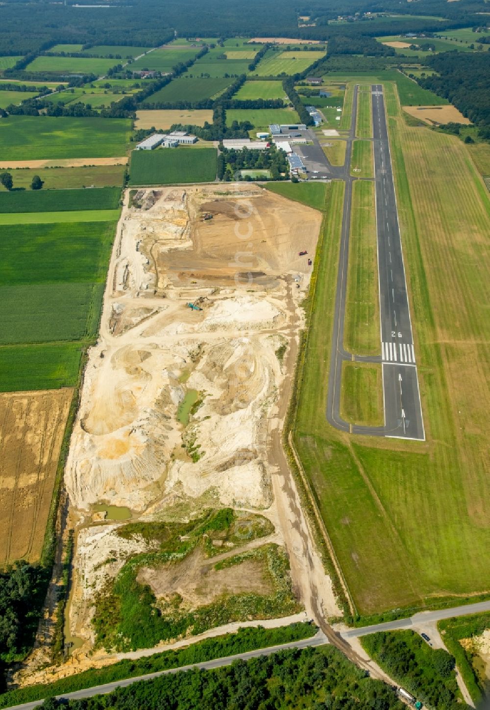 Bottrop from the bird's eye view: Site and tailings area of the gravel mining airfield Schwarze Heide on destrict Kirchhellen in Bottrop in the state North Rhine-Westphalia