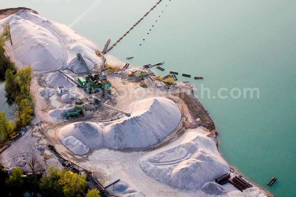 Aerial photograph Leimersheim - Site and tailings area of the gravel mining of Kieswerk Wolf - Markus Wolf Kieswerk and Transporte in the district Hardtwald in Leimersheim in the state Rhineland-Palatinate