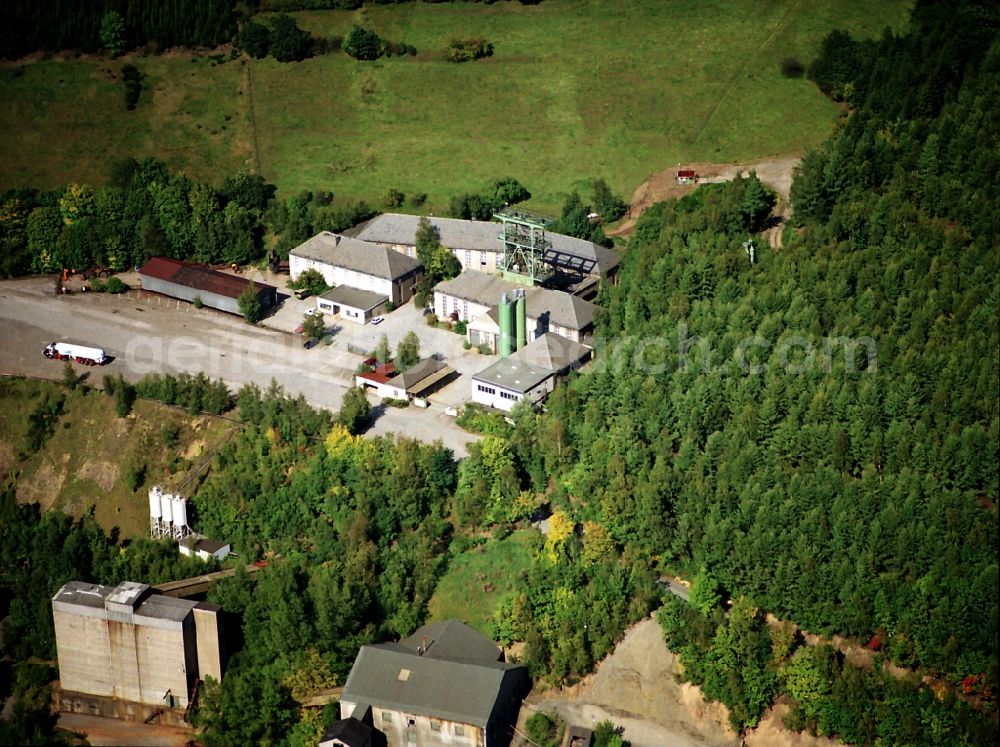 Lennestadt from the bird's eye view: Site and tailings area of the gravel mining in Lennestadt in the state North Rhine-Westphalia