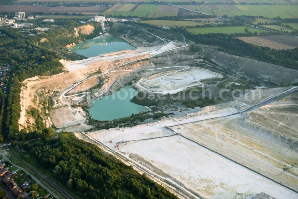 Lägerdorf from the bird's eye view: Site and tailings area of the gravel mining of the united Kreide werke Dammann KG in Laegerdorf in the state Schleswig-Holstein