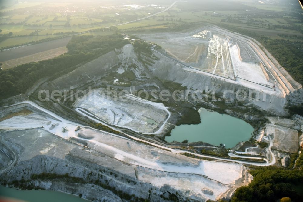 Lägerdorf from the bird's eye view: Site and tailings area of the gravel mining of the united Kreide werke Dammann KG in Laegerdorf in the state Schleswig-Holstein