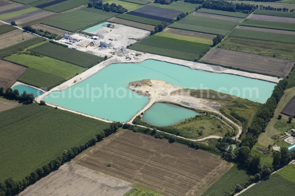 Neuching from the bird's eye view: Site and tailings area of the gravel mining in Neuching in the state Bavaria, Germany