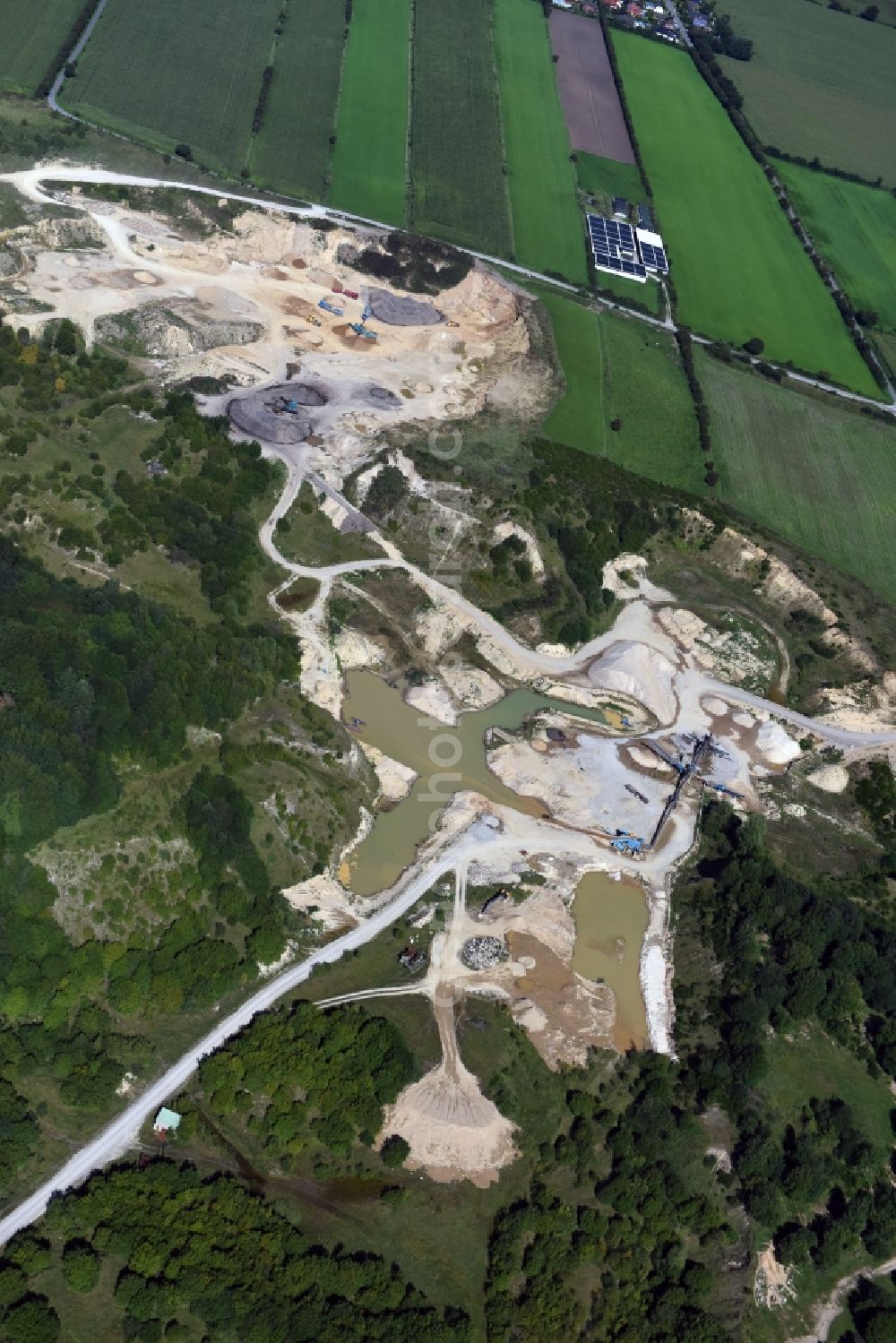 Oeversee from the bird's eye view: Site and tailings area of the gravel mining of the Gonde Clausen Kies- und Betonwerk Oeversee GmbH in Oeversee in the state Schleswig-Holstein