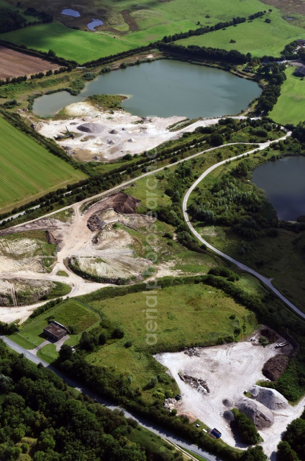 Aerial photograph Oeversee - Site and tailings area of the gravel mining of the Gonde Clausen Kies- und Betonwerk Oeversee GmbH in Oeversee in the state Schleswig-Holstein