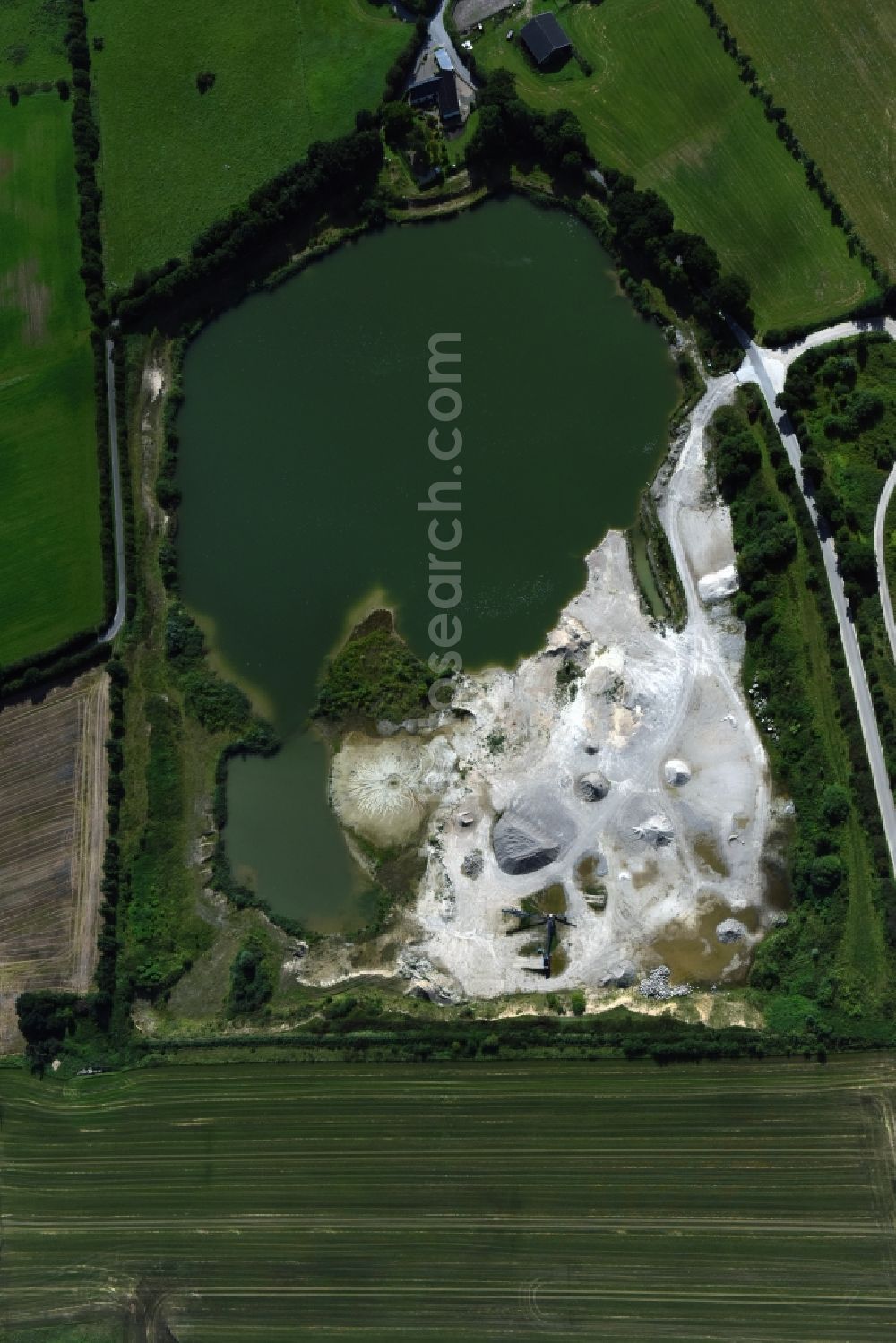 Oeversee from above - Site and tailings area of the gravel mining of the Gonde Clausen Kies- und Betonwerk Oeversee GmbH in Oeversee in the state Schleswig-Holstein