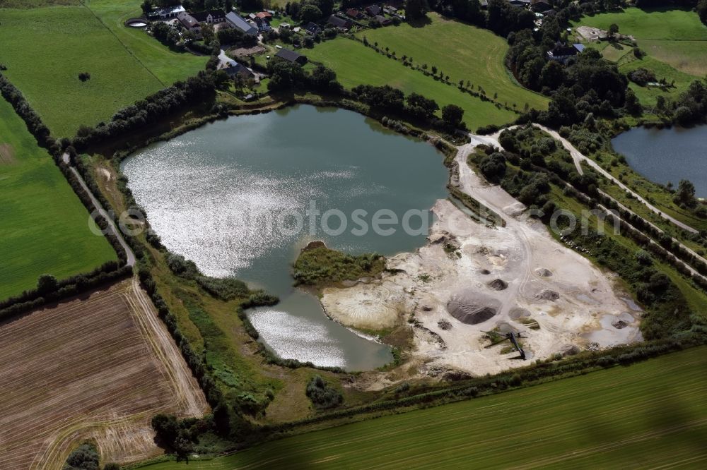 Oeversee from above - Site and tailings area of the gravel mining of the Gonde Clausen Kies- und Betonwerk Oeversee GmbH in Oeversee in the state Schleswig-Holstein