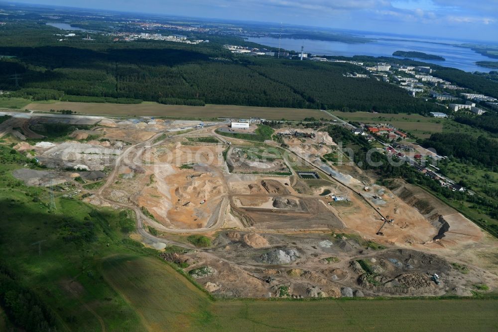 Plate from above - Site and tailings area of the gravel mining of OTTO DOeRNER GmbH & Co. KG in the district Consrade in Plate in the state Mecklenburg - Western Pomerania, Germany