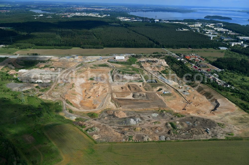 Plate from the bird's eye view: Site and tailings area of the gravel mining of OTTO DOeRNER GmbH & Co. KG in the district Consrade in Plate in the state Mecklenburg - Western Pomerania, Germany