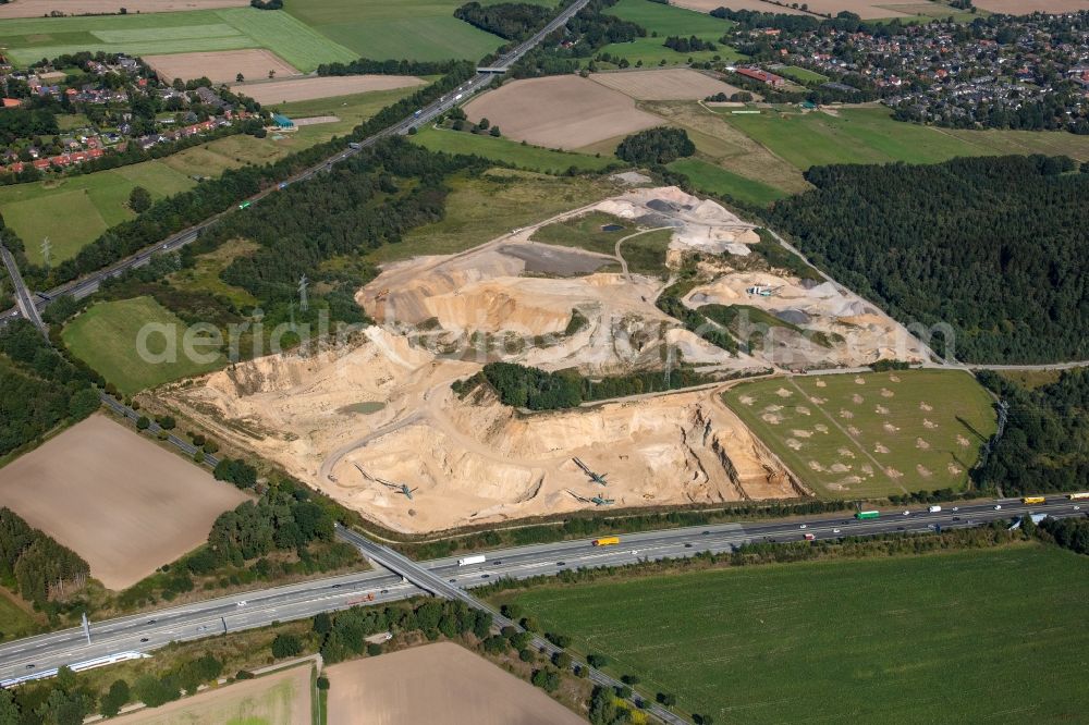 Aerial photograph Buchholz in der Nordheide - Site and tailings area of the gravel mining RBS Sand- and Kiesbetrieb GmbH & Co. KG on Soeoel'n in Buchholz in der Nordheide in the state Lower Saxony, Germany