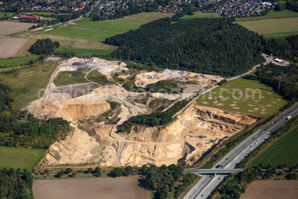 Buchholz in der Nordheide from above - Site and tailings area of the gravel mining RBS Sand- and Kiesbetrieb GmbH & Co. KG on Soeoel'n in Buchholz in der Nordheide in the state Lower Saxony, Germany