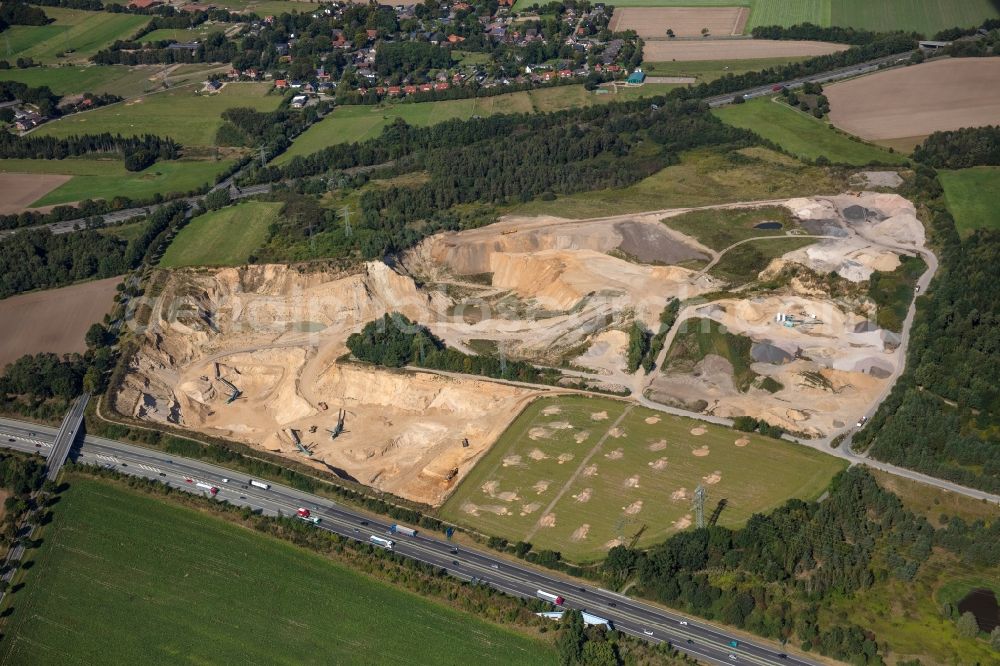 Aerial photograph Buchholz in der Nordheide - Site and tailings area of the gravel mining RBS Sand- and Kiesbetrieb GmbH & Co. KG on Soeoel'n in Buchholz in der Nordheide in the state Lower Saxony, Germany