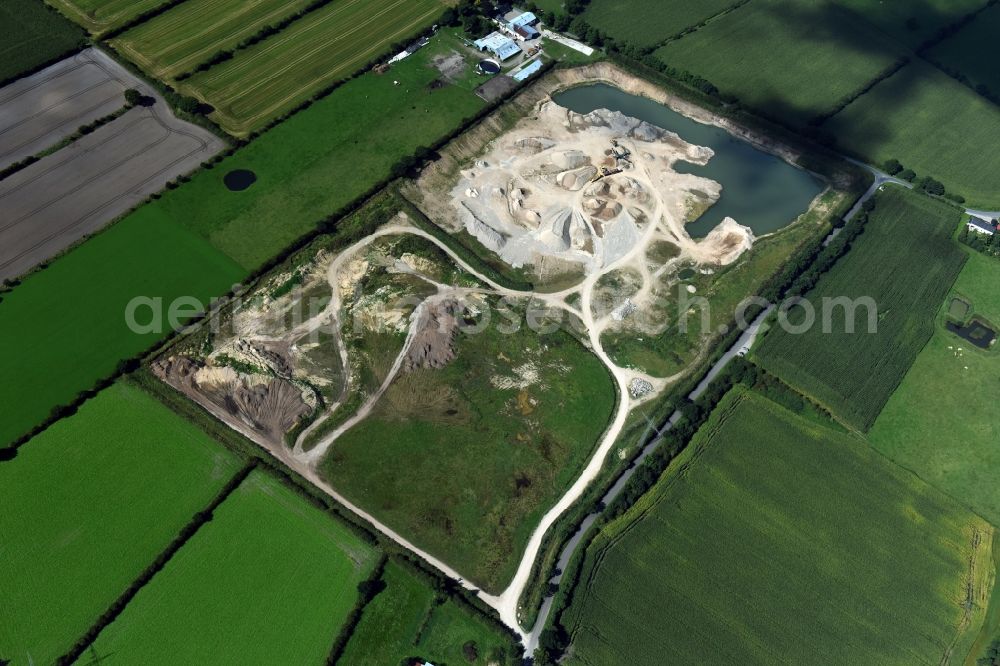 Oeversee from the bird's eye view: Site and tailings area of the gravel mining of the Gonde Clausen Kies- und Betonwerk Oeversee GmbH at the Sankelmarker lake in Oeversee in the state Schleswig-Holstein