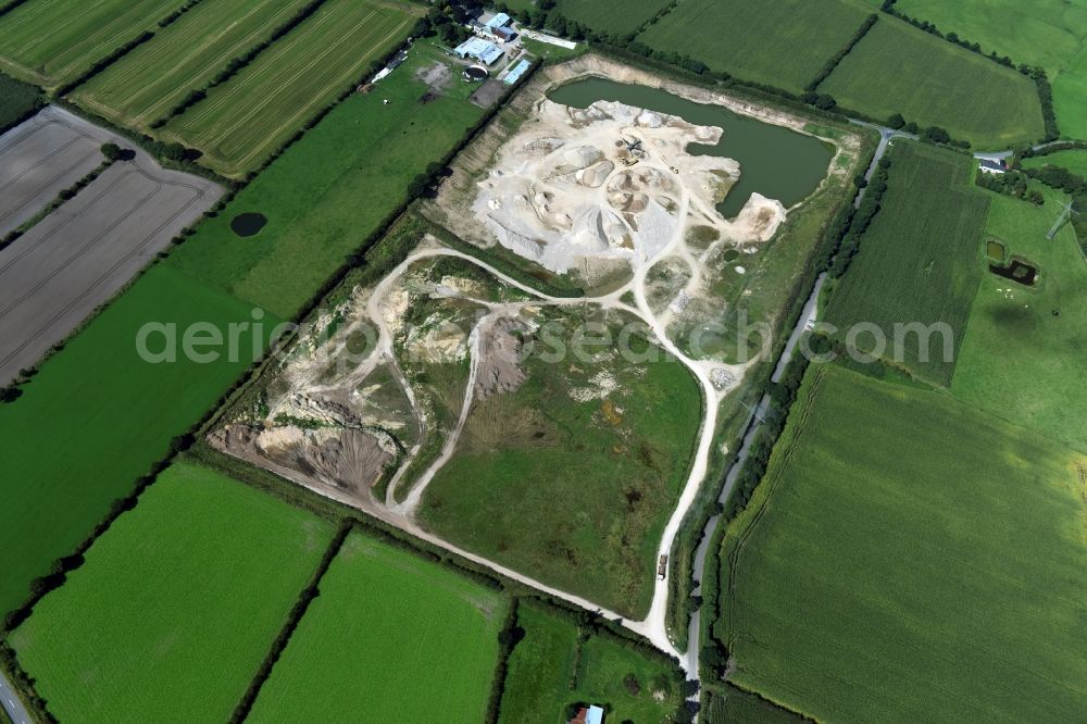 Oeversee from the bird's eye view: Site and tailings area of the gravel mining of the Gonde Clausen Kies- und Betonwerk Oeversee GmbH at the Sankelmarker lake in Oeversee in the state Schleswig-Holstein