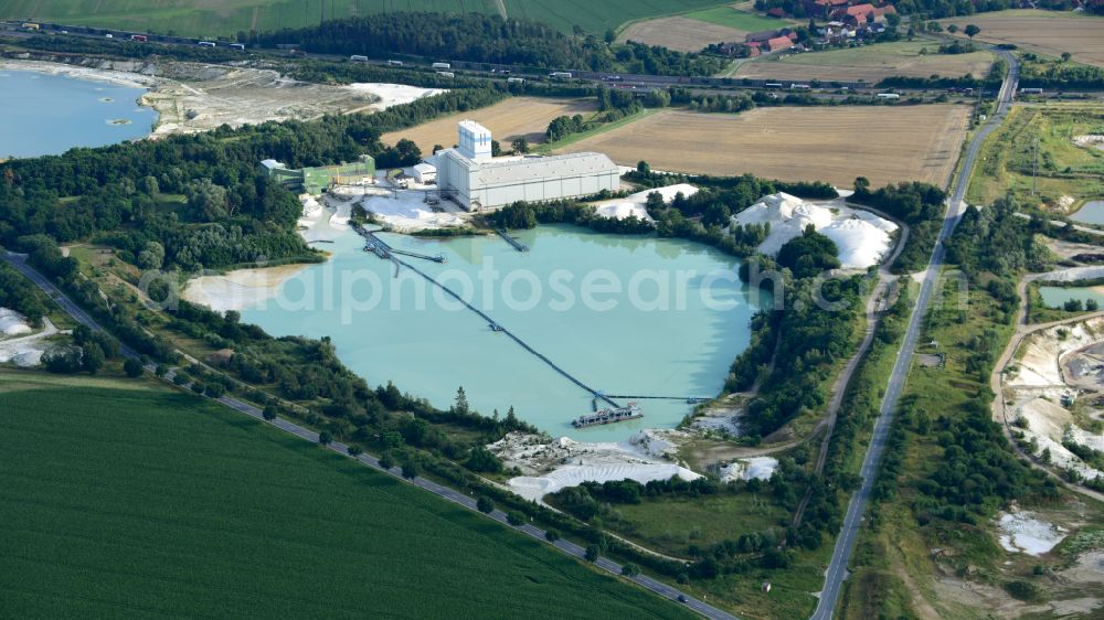 Uhry from above - Site and tailings area of the gravel mining Schlingmeier Quarzsand - factory in Uhry in the state Lower Saxony, Germany