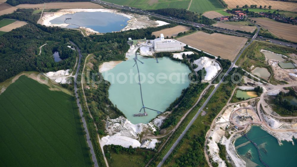 Uhry from the bird's eye view: Site and tailings area of the gravel mining Schlingmeier Quarzsand - factory in Uhry in the state Lower Saxony, Germany