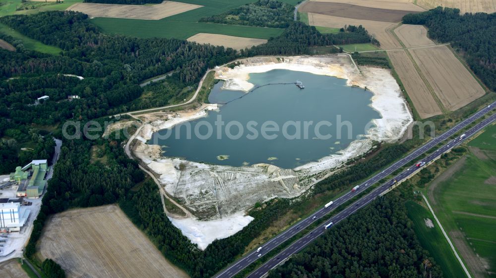 Uhry from above - Site and tailings area of the gravel mining Schlingmeier Quarzsand - factory in Uhry in the state Lower Saxony, Germany