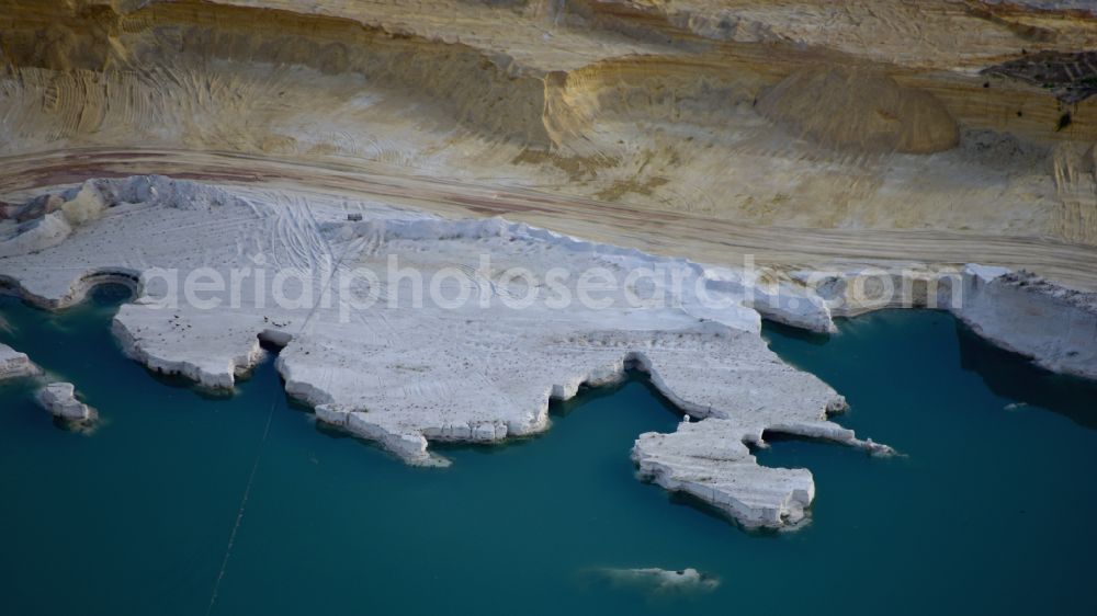 Uhry from above - Site and tailings area of the gravel mining Schlingmeier Quarzsand - factory in Uhry in the state Lower Saxony, Germany