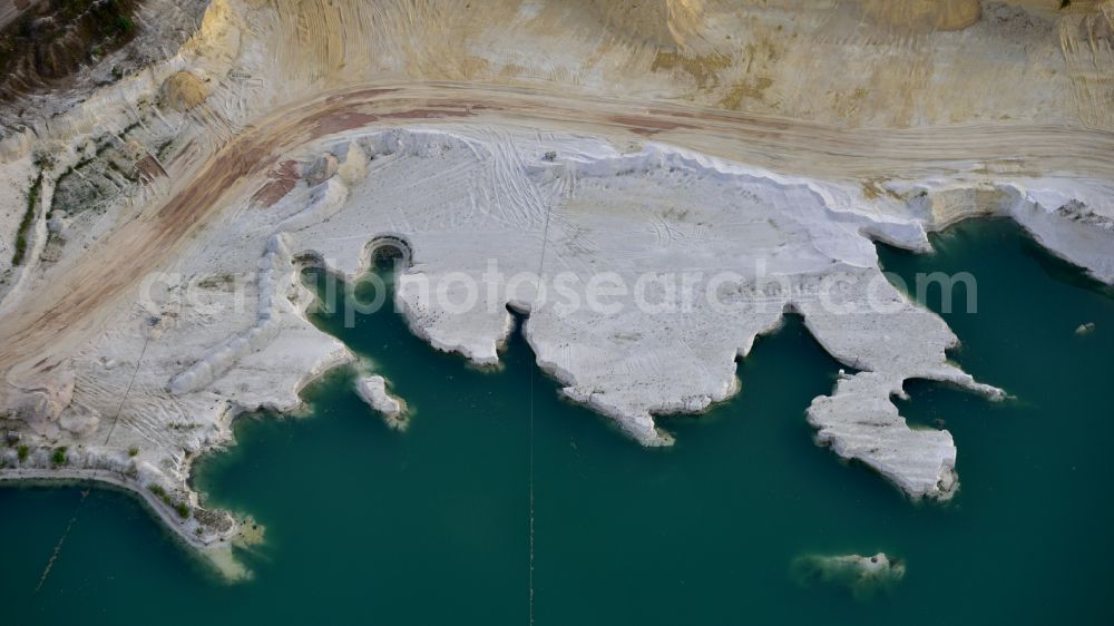 Uhry from above - Site and tailings area of the gravel mining Schlingmeier Quarzsand - factory in Uhry in the state Lower Saxony, Germany