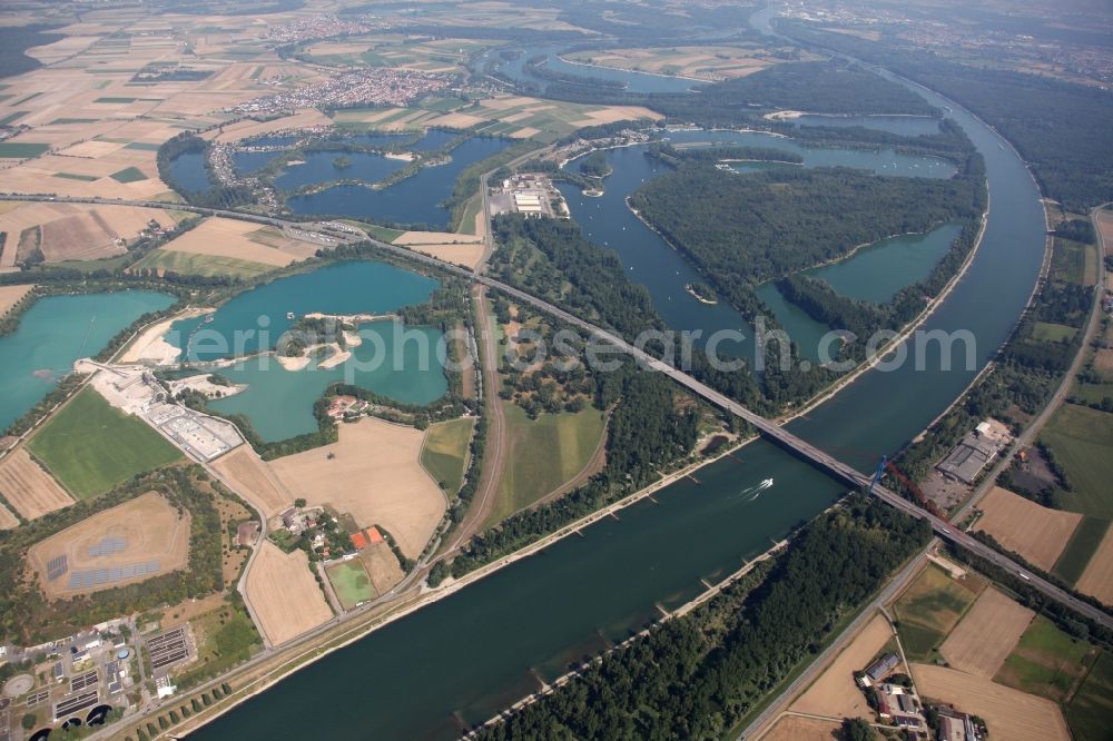 Speyer from the bird's eye view: Site and tailings area of the gravel mining im See Deutschewuehl in Speyer in the state Rhineland-Palatinate. The quarry and the other lakes have emerged from earlier Rhein loops after it has been straightened 