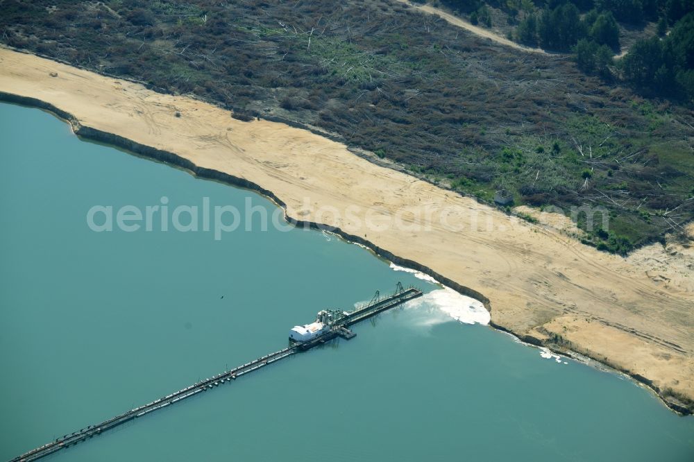 Spreenhagen from the bird's eye view: Site and tailings area of the gravel mining lake in Spreenhagen in the state Brandenburg