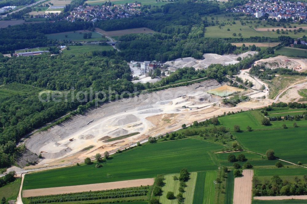 Weil am Rhein from above - Gravel pit on the mining site in Weil am Rhein in the state of Baden-Wuerttemberg. The mining permit for the gravel plant runs out, reclamation activities are necessary and a gravel biotope will emerge