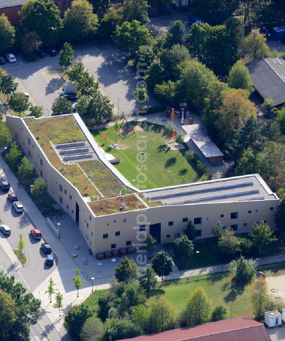 München from the bird's eye view: Daycare facility for children Haus der Kinder in the Trudering part of Munich in the state of Bavaria. The day-care center is the largest of Munich and includes a distinct architecture and a large outdoor area with playground