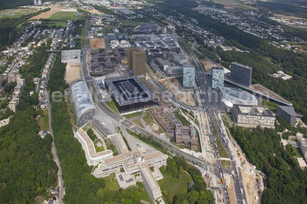 Aerial image Luxembourg Luxemburg - Kirchberg plateau with the buildings of the European Court of Justice, ECJ, to the left of the center. To the right, on both sides of the avenue John.F. Kennedy, two office towers, the Porte de L'Europe. Before this, the Philharmonie