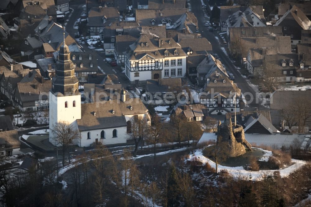 Meschede from the bird's eye view: Winter landscape with view of the Eversberg Church covered with snow in Meschede in North Rhine-Westphalia