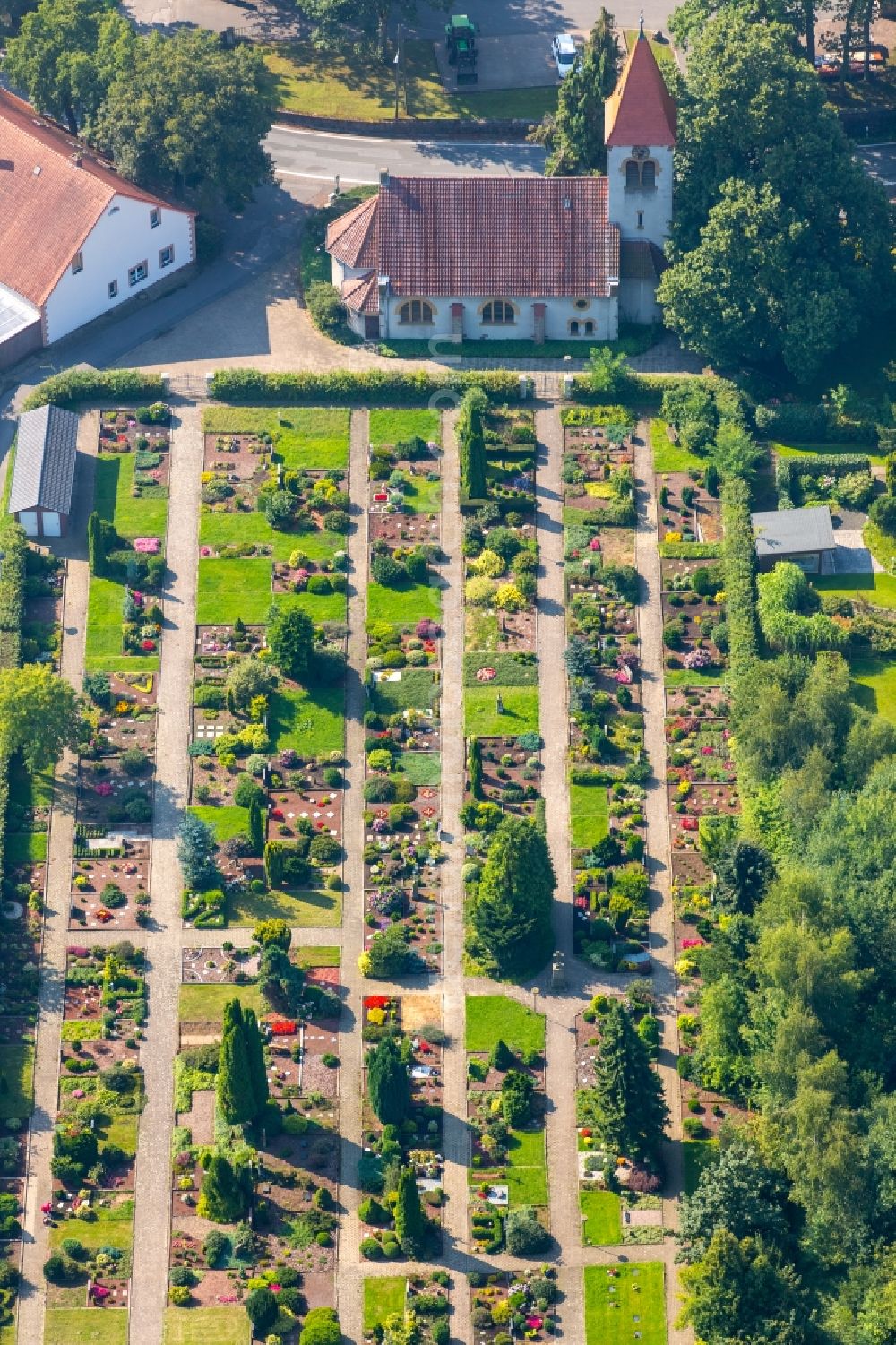 Bieren from the bird's eye view: Church and grave rows on the grounds of the cemetery in Bieren in the state North Rhine-Westphalia