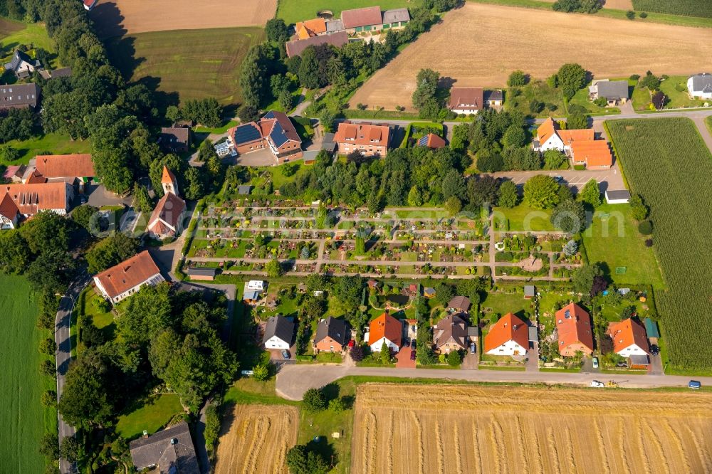 Bieren from above - Church and grave rows on the grounds of the cemetery in Bieren in the state North Rhine-Westphalia