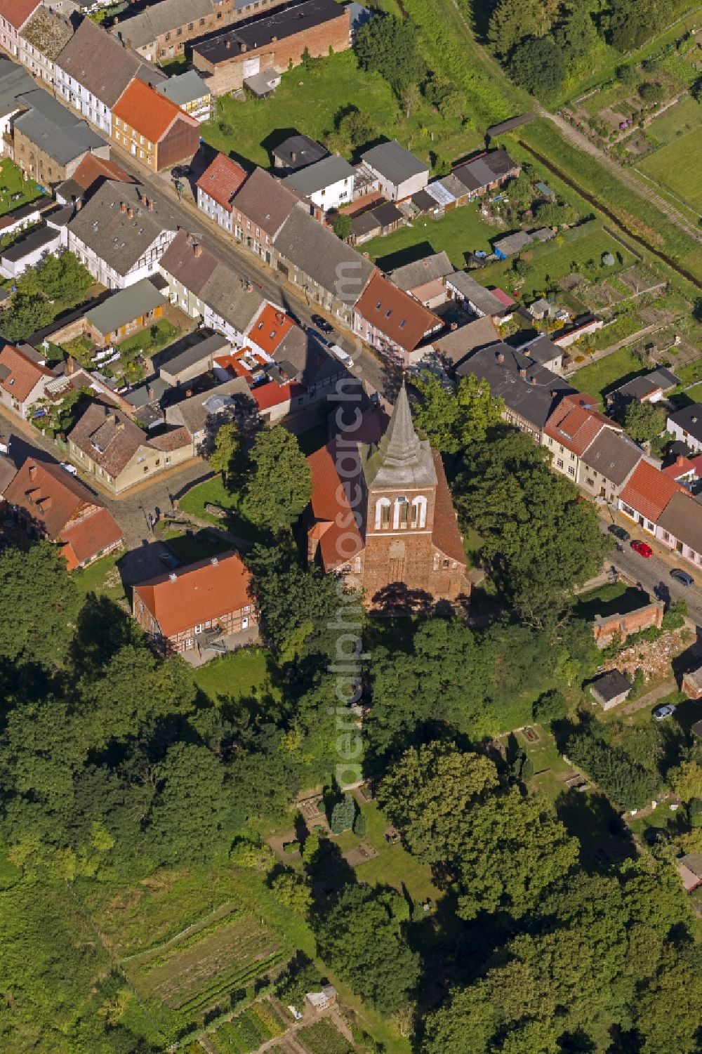 Lassan from the bird's eye view: Church and St. John's Parish Hall II in the village street village Lassan in Mecklenburg-Western Pomerania