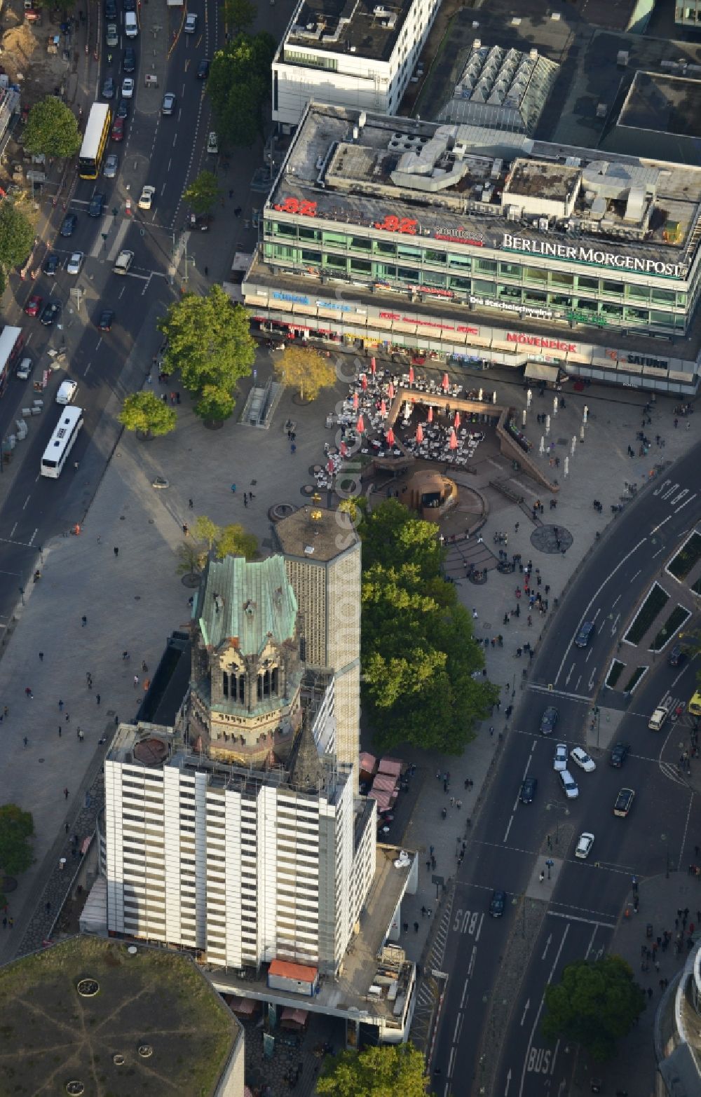 Aerial image Berlin - The Protestant Kaiser William Memorial Church, commonly short memorial church stands on the Breitscheidplatz between the Kurfürstendamm, the Tauentzienstraße and the Budapest street in Berlin's Charlottenburg district. The non-damaged part of the old church is now a museum and war memorial