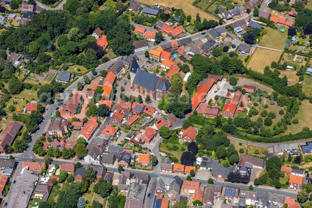 Enniger from above - Church building of St. Mauritius Church in the village centre of Enniger in the federal state of North Rhine-Westphalia, Germany