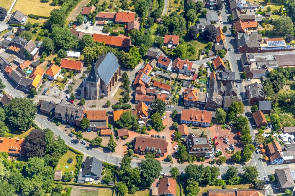 Aerial image Enniger - Church building of St. Mauritius Church in the village centre of Enniger in the federal state of North Rhine-Westphalia, Germany