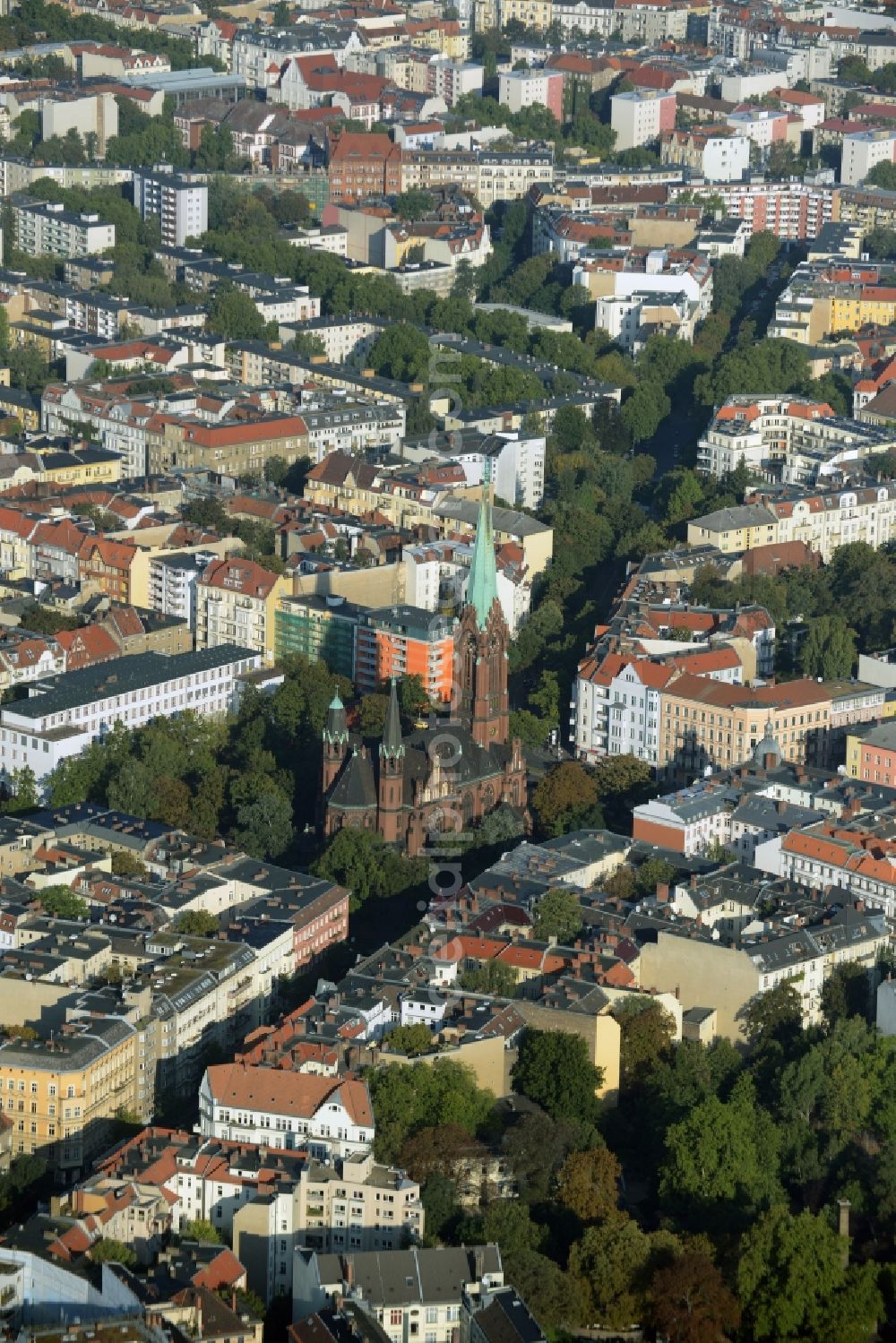 Berlin from the bird's eye view: Church building of Apostel-Paulus church in Akazienstrasse in the Schoeneberg part of Berlin in Germany. The brick building stems from the late 19th century and is listed as a protected building