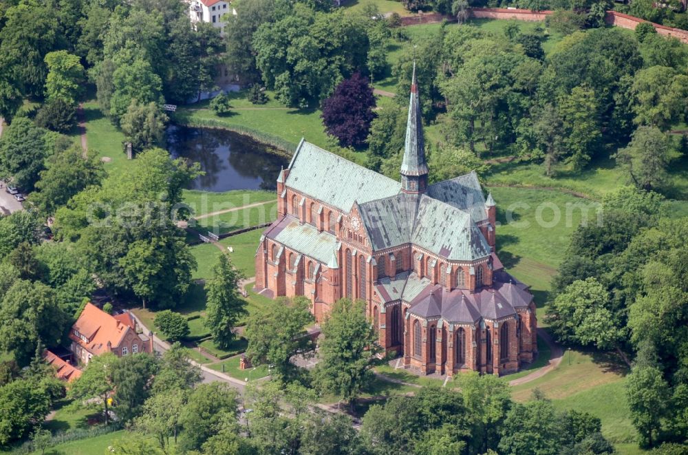 Bad Doberan from above - Church building of the Doberan Muenster in Bad Doberan in the state of Mecklenburg-Vorpommern, Germany. The Doberan Muenster was the monastery church of the Cistercian monastery of Doberan until the middle of the 16th century. It is now the Church of the Evangelical Lutheran Parish of Bad Doberan in the provost of Rostock in the Church district Mecklenburg of the Evangelical Lutheran Church in northern Germany. Muenster is one of the most important high-gothic brick buildings in the Baltic Sea region