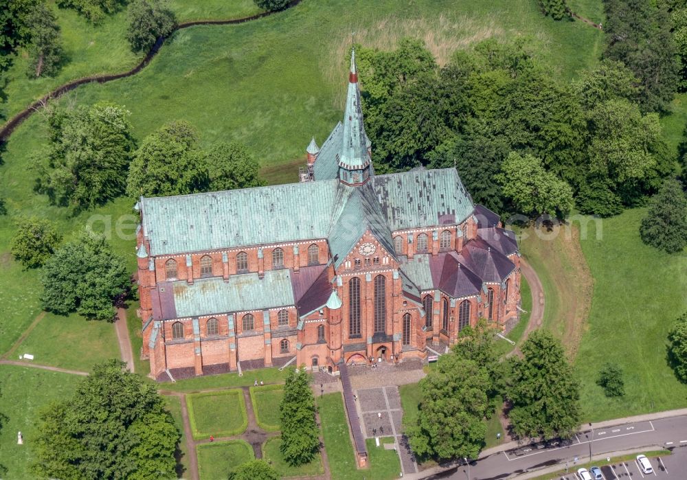 Bad Doberan from above - Church building of the Doberan Muenster in Bad Doberan in the state of Mecklenburg-Vorpommern, Germany. The Doberan Muenster was the monastery church of the Cistercian monastery of Doberan until the middle of the 16th century. It is now the Church of the Evangelical Lutheran Parish of Bad Doberan in the provost of Rostock in the Church district Mecklenburg of the Evangelical Lutheran Church in northern Germany. Muenster is one of the most important high-gothic brick buildings in the Baltic Sea region