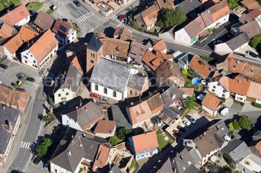 Dossenheim-sur-Zinsel from above - Protestantic Church building in the center of a circle of houses in the village of in Dossenheim-sur-Zinsel in Grand Est, France