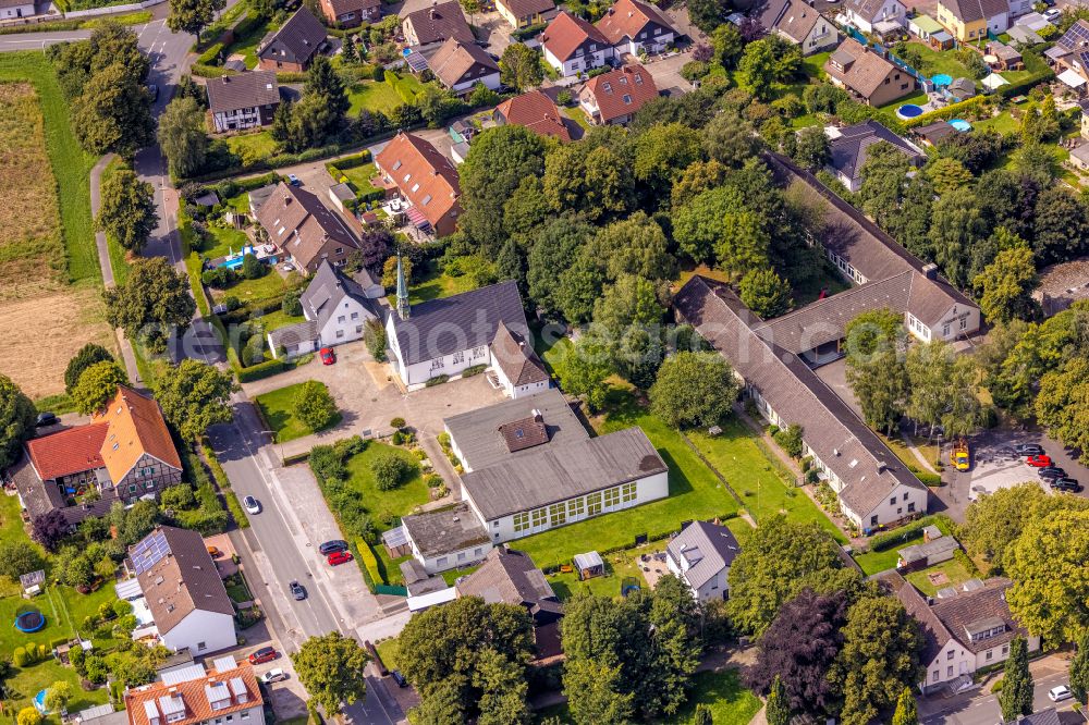 Aerial image Bergkamen - Church building the Church of the Resurrection of the Evangelical Peace Church Community in Bergkamen and the Martin Luther House on Ebertstrasse on street Goekenheide in the district Weddinghofen in Bergkamen in the state North Rhine-Westphalia, Germany