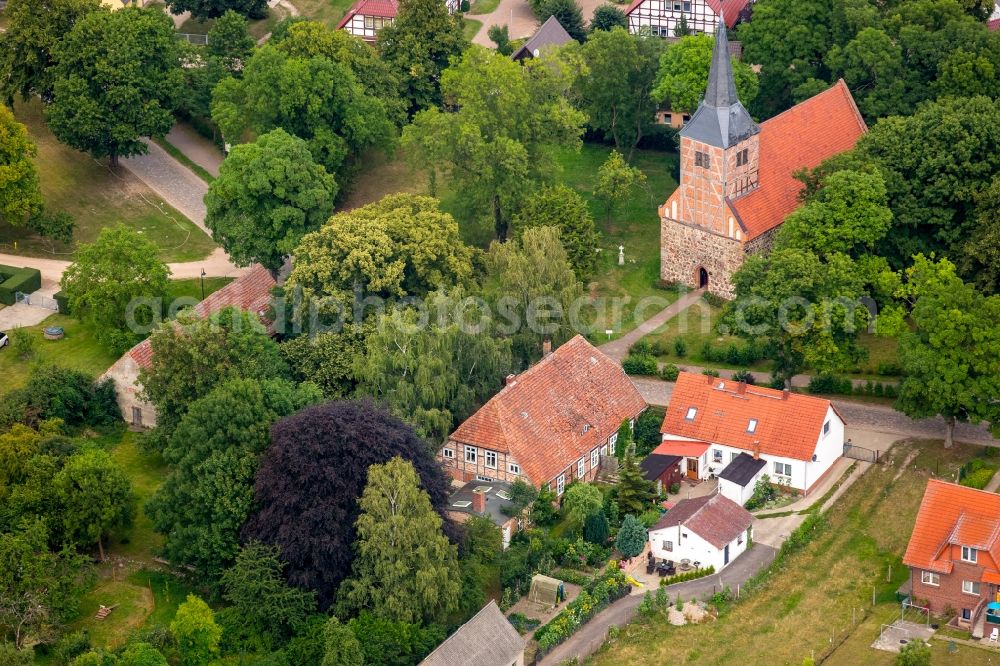 Vipperow from above - Church building of gray stone church with the old town hall on the village road in Vipperow in Mecklenburg-Vorpommern