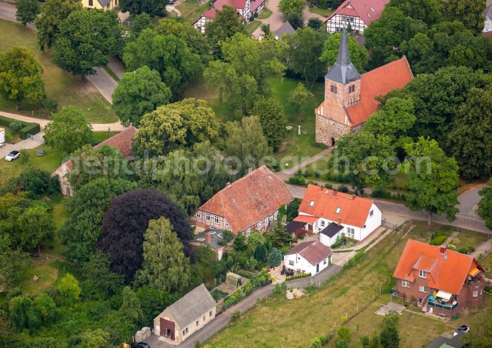 Vipperow from the bird's eye view: Church building of gray stone church with the old town hall on the village road in Vipperow in Mecklenburg-Vorpommern